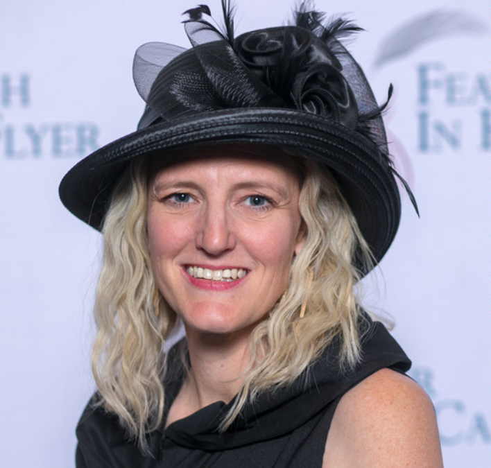 Laurie Hueneke Martens Receives “Feather in Her Cap” Award for Contributions to the Animal Health Industry